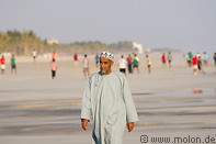 10 Omani man walking on beach
